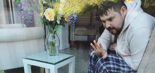 Tom, waving to his daughter Poppy at St Luke's Hospice in Plymouth