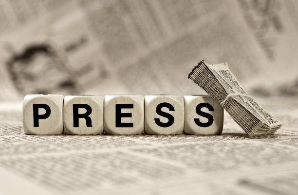 Press article stock image, the word PRESS spelt out with dice