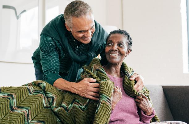 Man caring for older woman