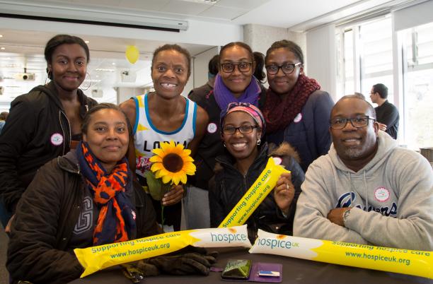 A group of Hospice UK supporters at the London Marathon with sunflowers