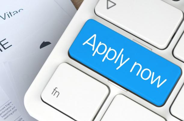 Picture of a keyboard with Apply now written on it