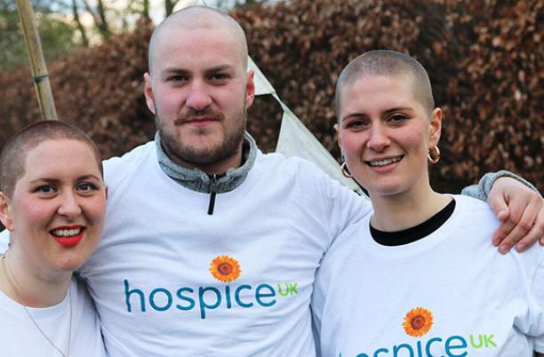 Photo of three people who braved a headshave for Hospice UK