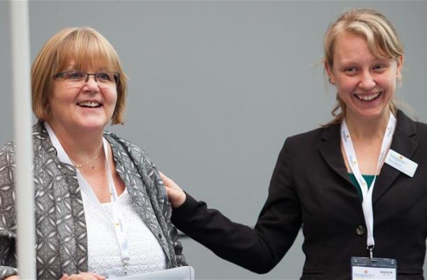 Two members of Hospice UK staff at the National Conference