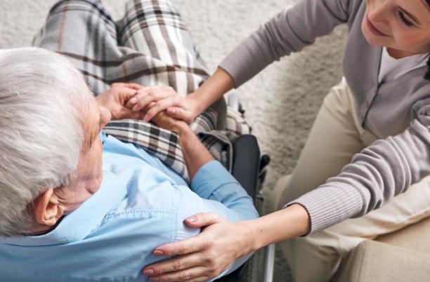Female carer and elderly man