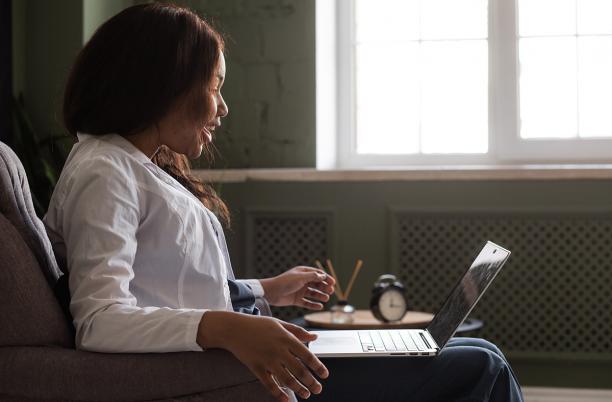 Woman at an event on her laptop