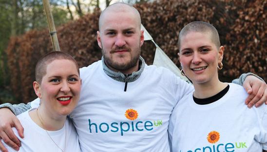 Photo of three people who braved a headshave for Hospice UK