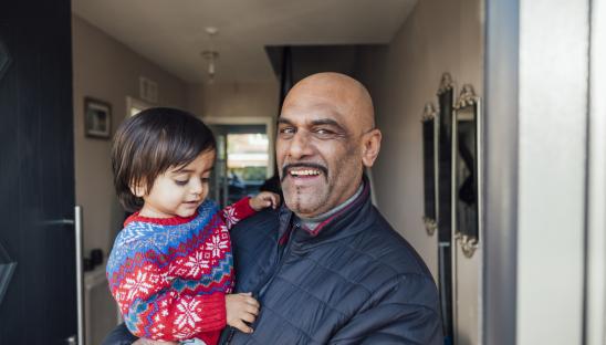 Grandfather holding his grandson